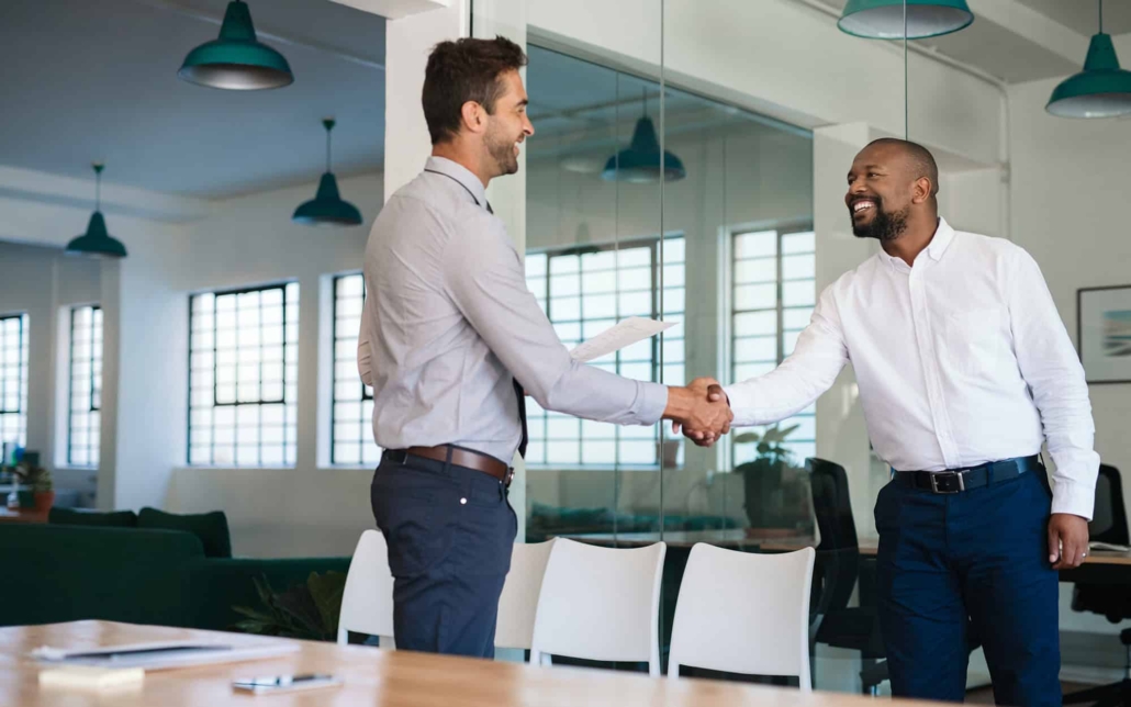 Two People Shaking Hands Before Interview